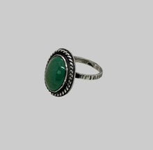 Load image into Gallery viewer, Silver ring with a green gemstone on a light gray background