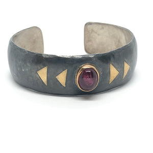 Handmade large sterling silver cuff with 18k gold bezel and 18k gold triangle embellishments.