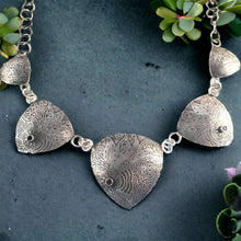 Load image into Gallery viewer, A sterling silver necklace featuring two amethyst stones with a floral pattern design.