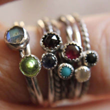 Load image into Gallery viewer, Set of 5 gemstone stackable rings in sterling silver on a finger, featuring colorful gemstones in plain, rope, and twist band styles.
