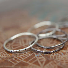 Load image into Gallery viewer, Textured wobble rings set. Seven sterling silver organic stacking rings. Hand textured stacking rings set.
