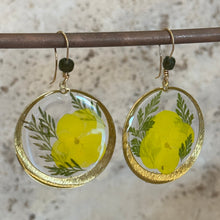 Load image into Gallery viewer, Earrings with yellow floral design on a textured surface, brass frame and resin 
