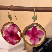 Load image into Gallery viewer, Resin earrings with pink flowers in brass frames 
