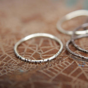 Textured wobble rings set.                                   Seven sterling silver organic stacking rings. Hand textured stacking rings set.